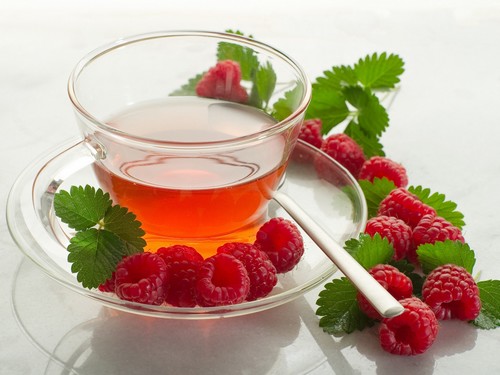 Hot tea with raspberries and honey